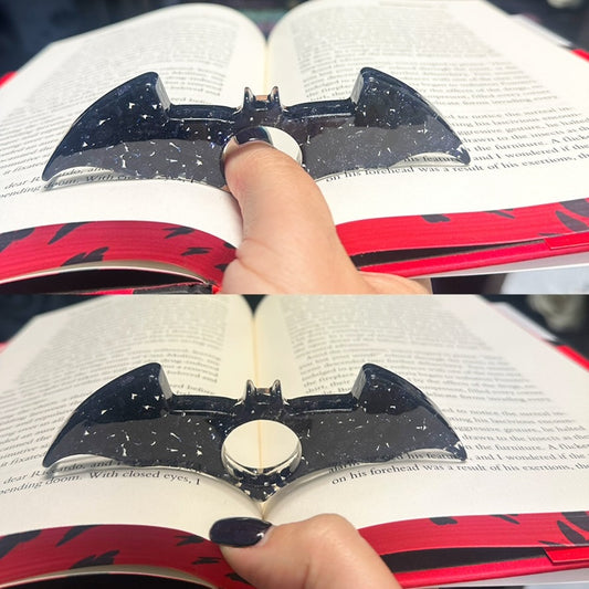 Bat thumb page holder